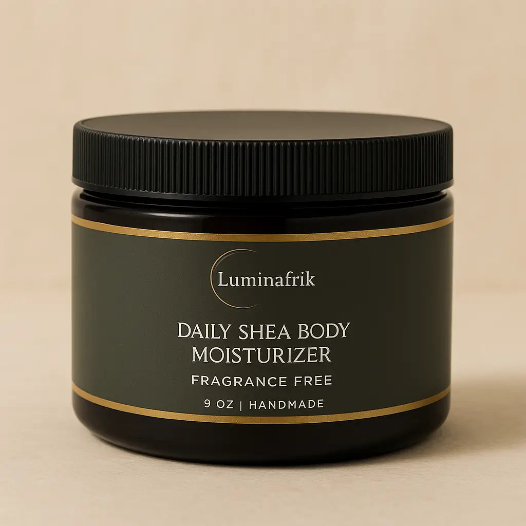 Luminafrik Daily Shea Body Moisturizer jar displayed on a soft beige background, highlighting the fragrance-free, handmade 9 oz body cream with a clean and elegant design.